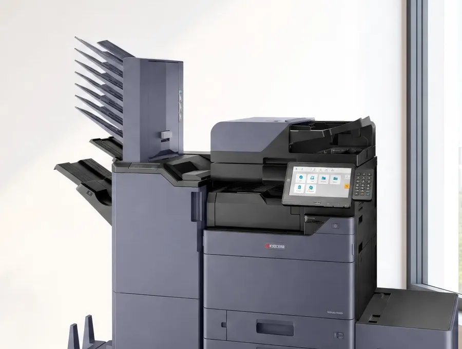 The finisher and the stacked mailbox trays on a Kyocera multifunction printer, each tray able to hold its own job